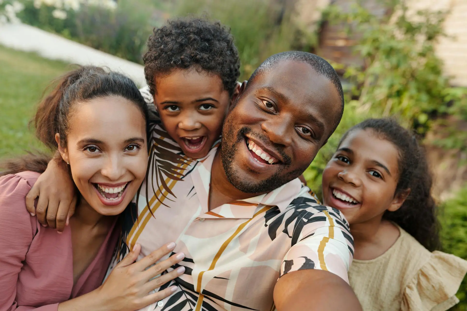 A family smiling for a group photo