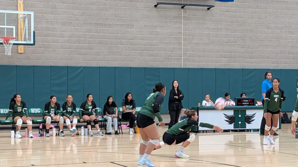 Senior Gabija Stankevicius digs deep to keep the ball in play.