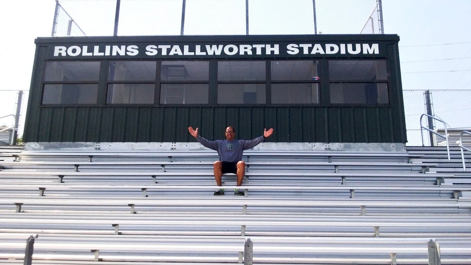 Rollins Stallworth seated at the top of the bleachers in his own stadium at Hug HS