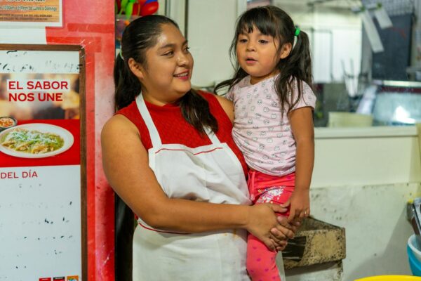 Happy Mother’s Day 2025! Smiling Mother Holding Daughter