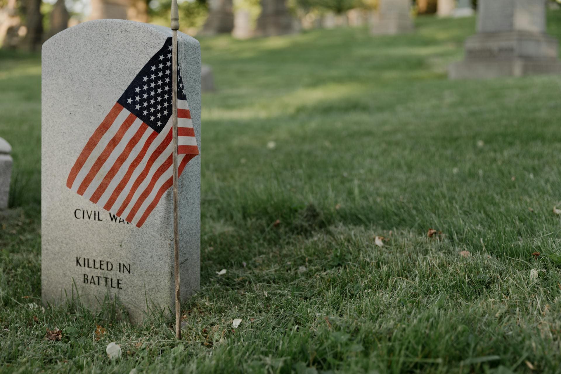 Photo by RDNE Stock project from Pexels: https://www.pexels.com/photo/veteran-s-tombstone-8865407/