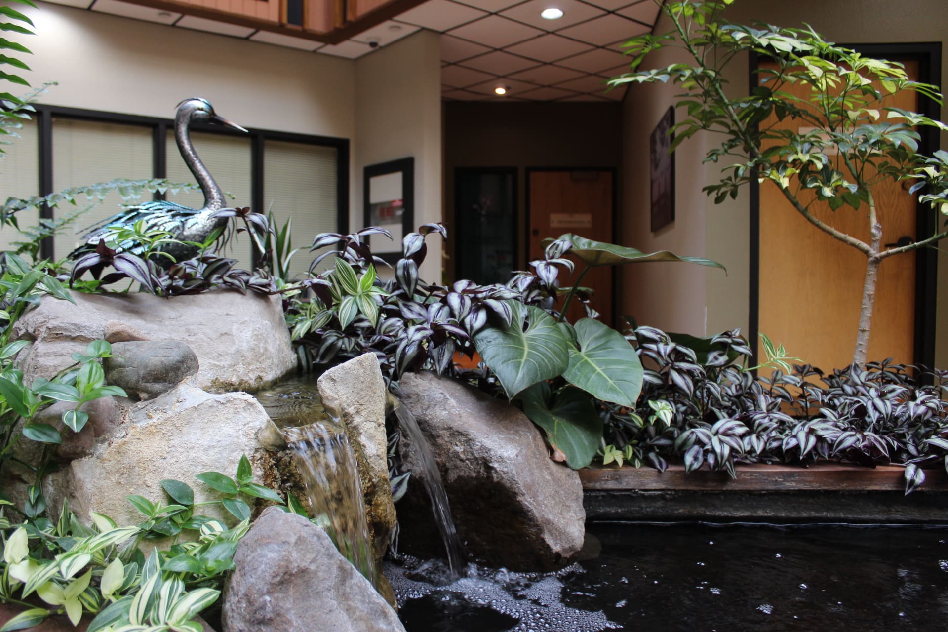 A small waterfall creates a beautiful ambiance in the atrium