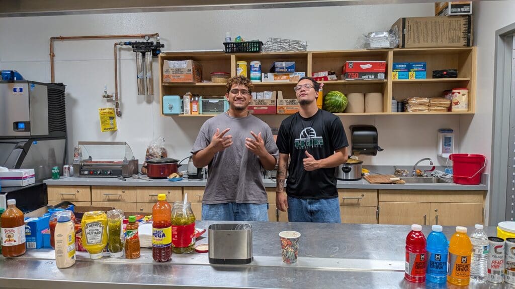 Michael Lui (Hug HS Class of 2024) and Sioeli Manu man the concessions booth at the Hug Varsity Volleyball Invitational on Saturday, August 16, 2025 at Hug High School