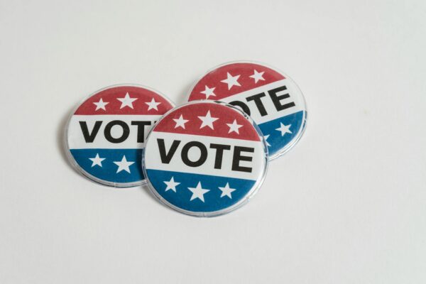 Image courtesy of Sora Shimazaki on Pexels. https://www.pexels.com/photo/us-voting-badges-on-white-surface-5926409/