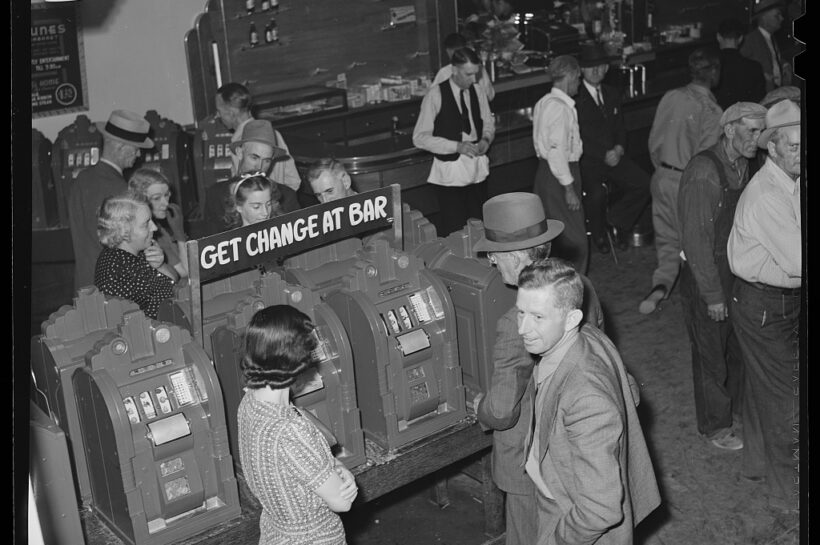 Slot machine players. Las Vegas, Nevada intermediary roll film. Library of Congress, Prints & Photographs Division, Farm Security Administration/Office of War Information Black-and-White Negatives. https://www.loc.gov/resource/fsa.8b19717/