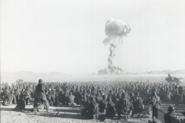 Operation Buster-Jangle: 'Dog' test, with troops participating in exercise Desert Rock I. It was the first U.S. nuclear field exercise conducted on land; troops shown are a mere 6 miles from the blast. At the Nevada Test Site, 1 November 1951. Federal Government of the United States, Public domain, via Wikimedia Commons.