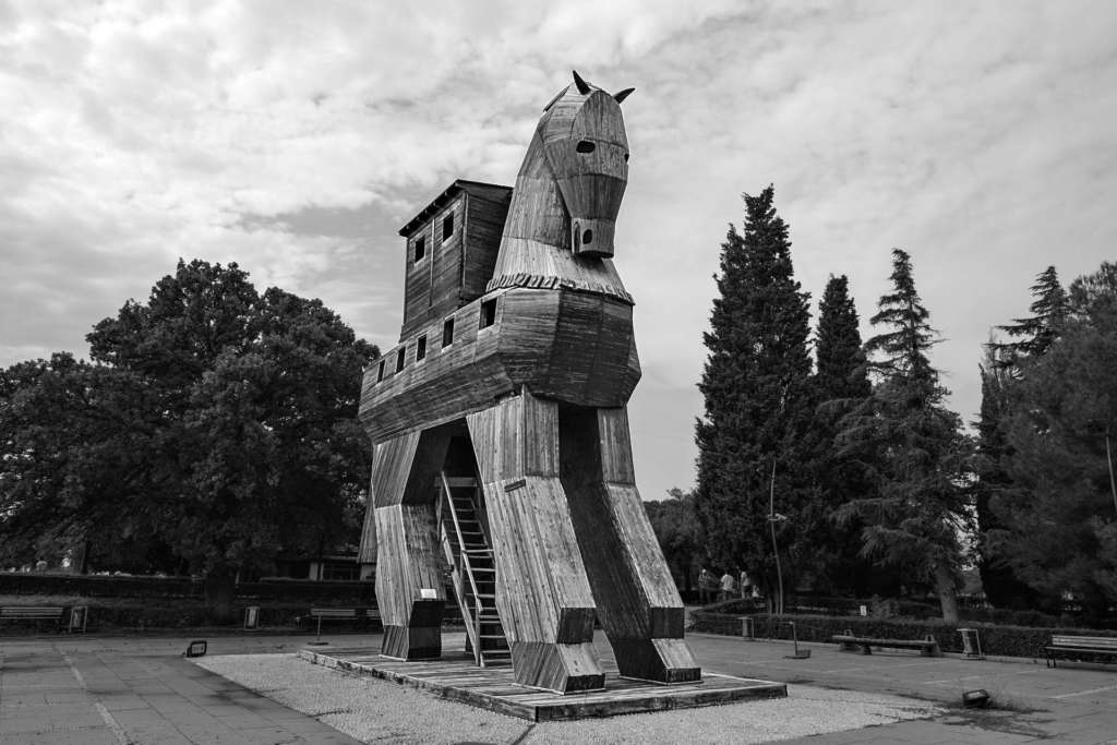 Black and white image of the famous Trojan Horse replica in Çanakkale, Türkiye. Photo by Ayşe İpek from Pexels: https://www.pexels.com/photo/black-and-white-photography-of-a-wooden-trojan-horse-13384971/